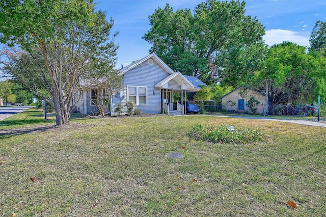 2119 N Woods St, Sherman, TX 75092 - ranch-style house featuring fence and a front yard