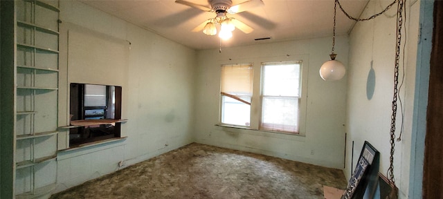 empty room featuring concrete floors and ceiling fan