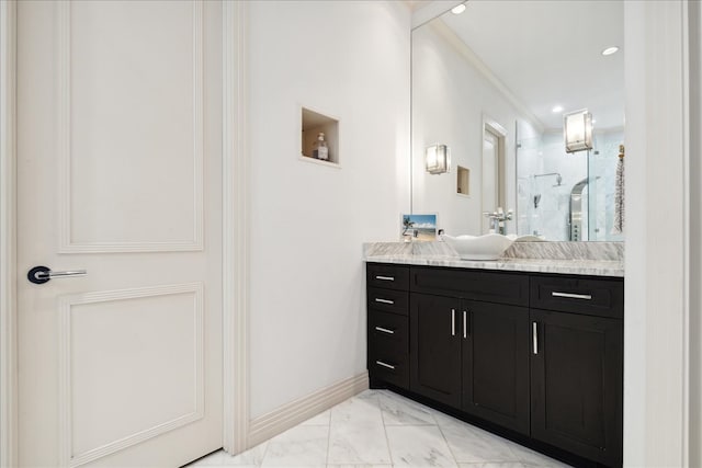 bathroom with vanity, ornamental molding, and walk in shower