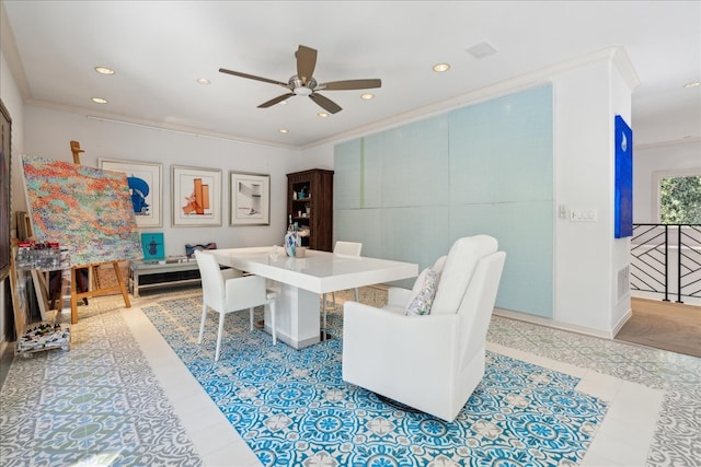 dining area with crown molding, light tile patterned flooring, and ceiling fan