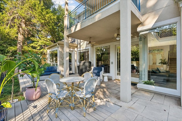 view of patio / terrace featuring ceiling fan and a balcony