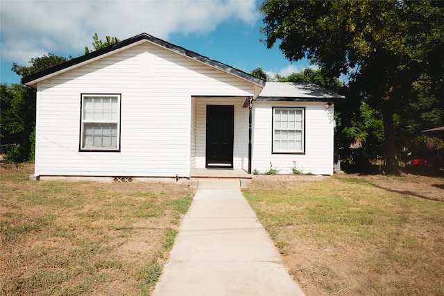 bungalow with a front lawn