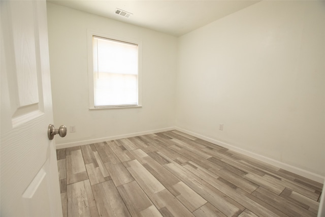 unfurnished room featuring light hardwood / wood-style floors