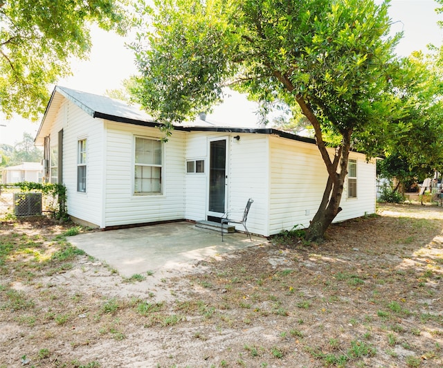 rear view of property featuring a patio area