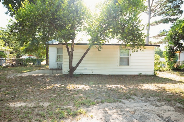 back of house with a patio