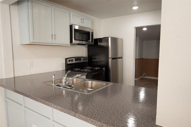 kitchen with white cabinetry, sink, and appliances with stainless steel finishes