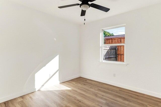 unfurnished bedroom with a closet, light wood-type flooring, and ceiling fan