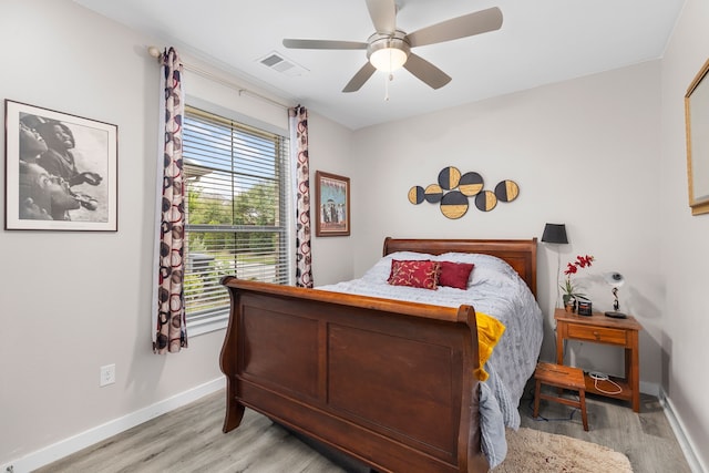 bedroom featuring light wood-type flooring and ceiling fan