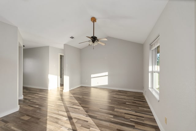 unfurnished room with lofted ceiling, ceiling fan, and dark hardwood / wood-style flooring