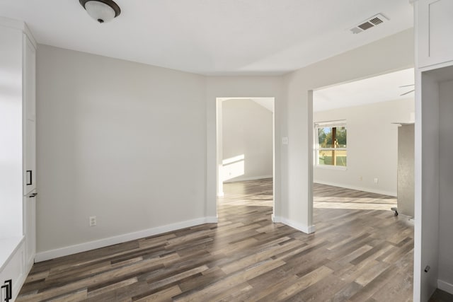 spare room featuring dark hardwood / wood-style flooring