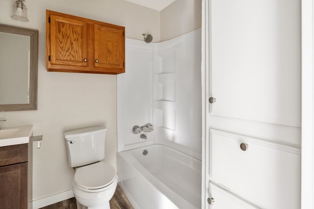 full bathroom featuring vanity, toilet, hardwood / wood-style flooring, and  shower combination