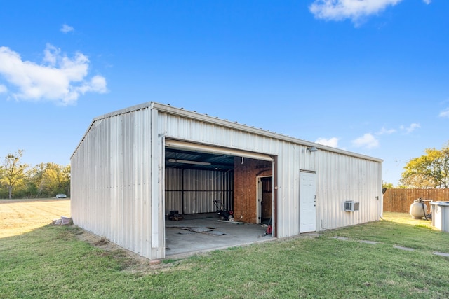 view of outbuilding with a yard