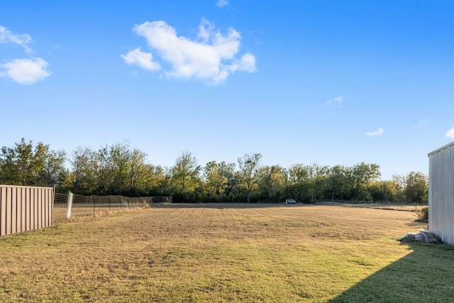 view of yard with a rural view