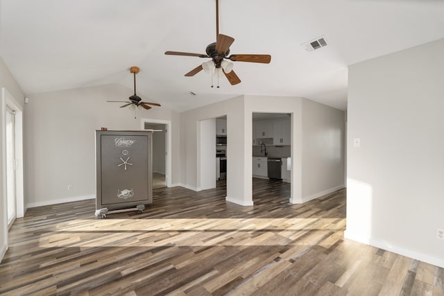 unfurnished living room featuring sink, vaulted ceiling, ceiling fan, and dark hardwood / wood-style flooring