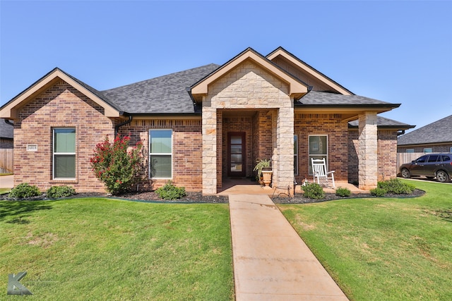 craftsman-style home featuring a front lawn