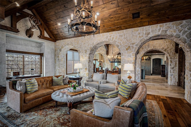 3801 Dugas Rd, Aubrey, TX 76227 - living room featuring a notable chandelier, wood-type flooring, arched walkways, high vaulted ceiling, and wood ceiling