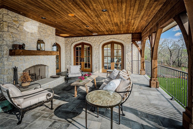 3801 Dugas Rd, Aubrey, TX 76227 - view of patio / terrace featuring french doors and an outdoor living space with a fireplace