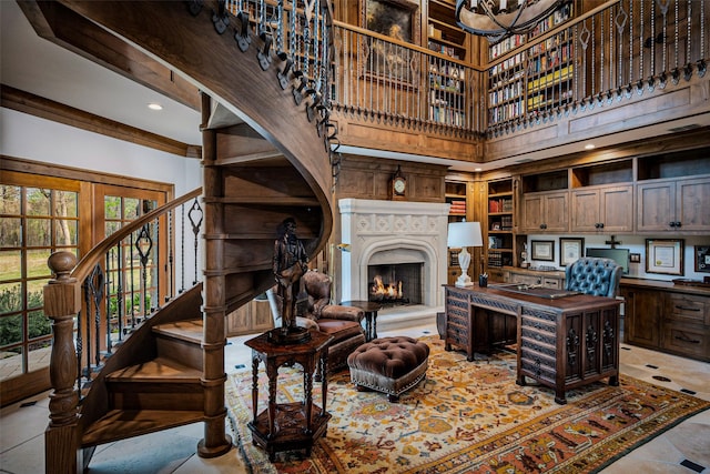 3801 Dugas Rd, Aubrey, TX 76227 - living area featuring stairs, a warm lit fireplace, and a towering ceiling