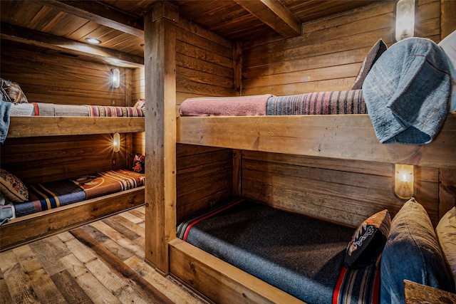 3801 Dugas Rd, Aubrey, TX 76227 - bedroom with beam ceiling, wooden ceiling, wooden walls, a sauna, and hardwood / wood-style floors