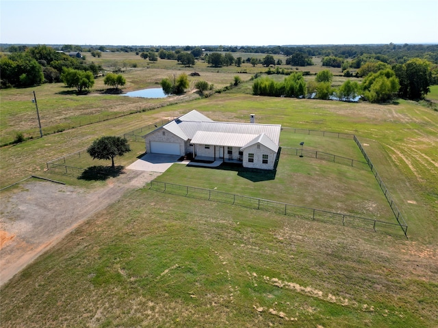 drone / aerial view with a water view and a rural view