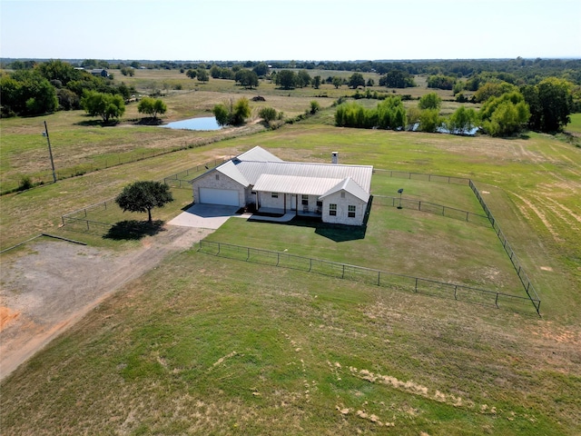 bird's eye view featuring a water view and a rural view