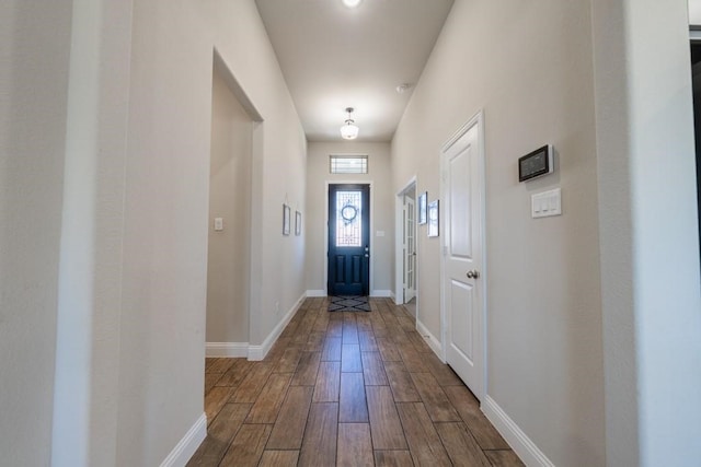 doorway with hardwood / wood-style floors