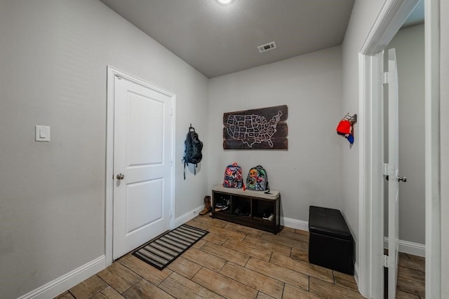 foyer entrance with light hardwood / wood-style floors