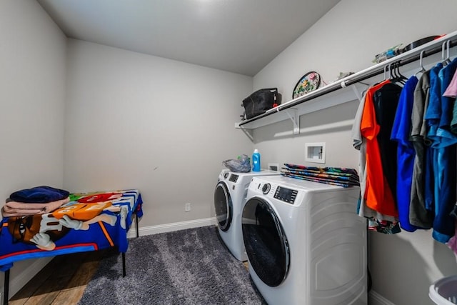 washroom featuring washer and dryer and dark hardwood / wood-style flooring