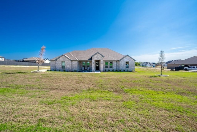 view of front of home with a front lawn and a patio area