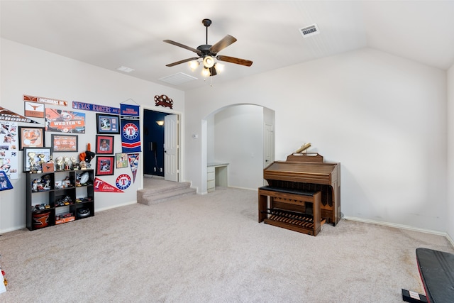 misc room featuring light carpet, vaulted ceiling, and ceiling fan