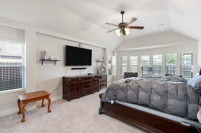 bedroom with lofted ceiling, ceiling fan, and light colored carpet