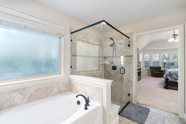 bathroom featuring independent shower and bath, tile patterned flooring, vaulted ceiling, and ceiling fan