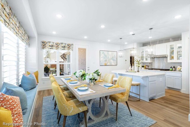 dining space with light hardwood / wood-style floors