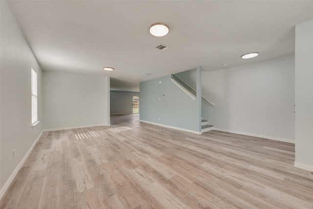 unfurnished living room with light wood-type flooring