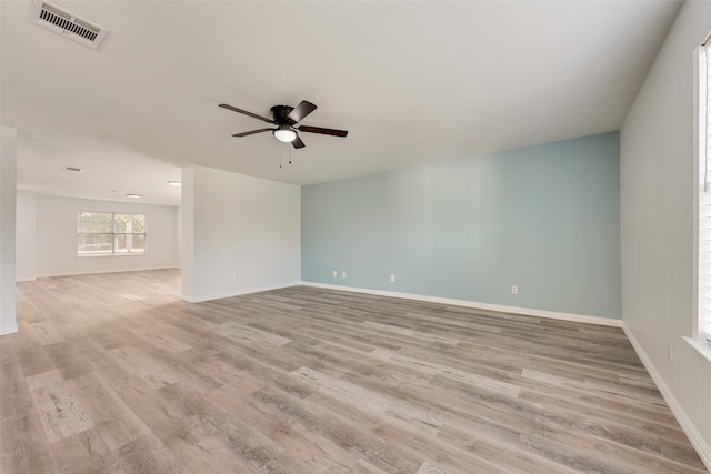 spare room with light hardwood / wood-style flooring and ceiling fan