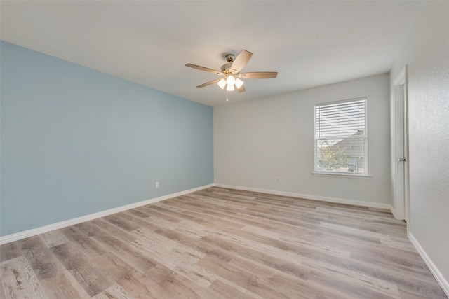 empty room with light wood-type flooring and ceiling fan