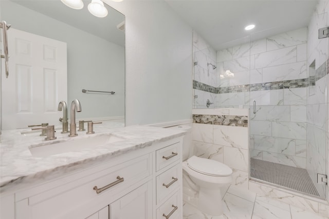 bathroom with toilet, vanity, and walk in shower