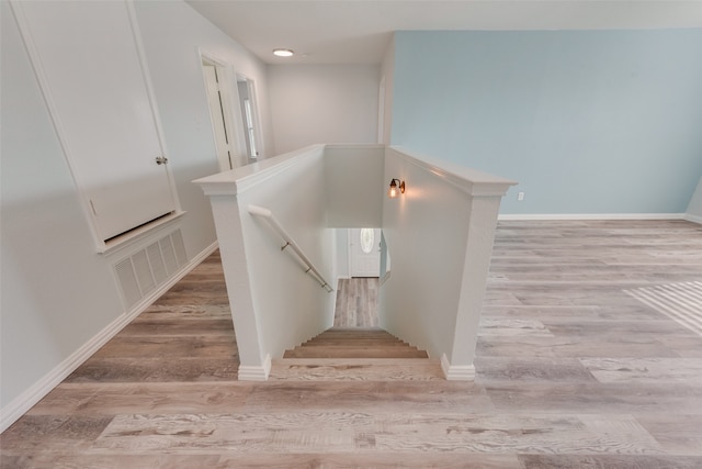 staircase featuring hardwood / wood-style floors