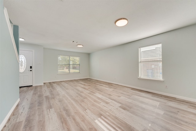 foyer with light hardwood / wood-style flooring