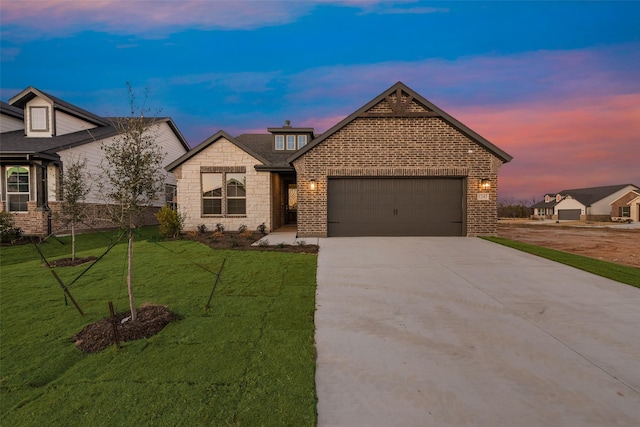 view of front of house with a lawn and a garage