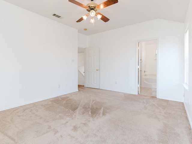 unfurnished room with visible vents, baseboards, a ceiling fan, and light carpet