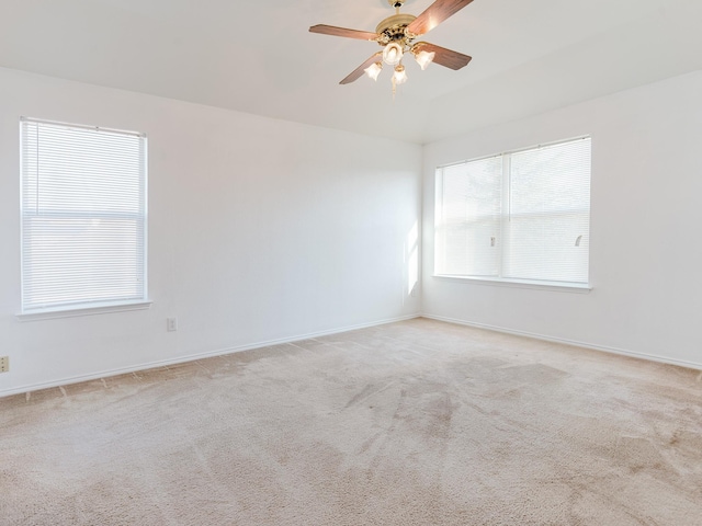 unfurnished room featuring baseboards, a ceiling fan, and carpet flooring