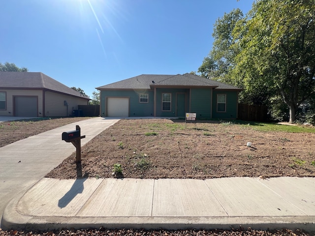 single story home with a garage