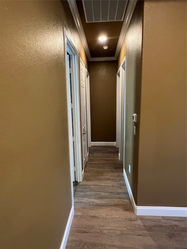 hall featuring ornamental molding and wood-type flooring