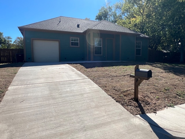 single story home with a garage