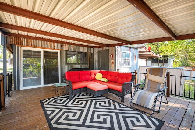 wooden deck with an outdoor hangout area and a shed