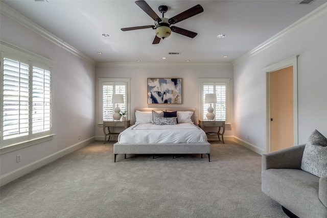 carpeted bedroom with multiple windows, ceiling fan, and crown molding