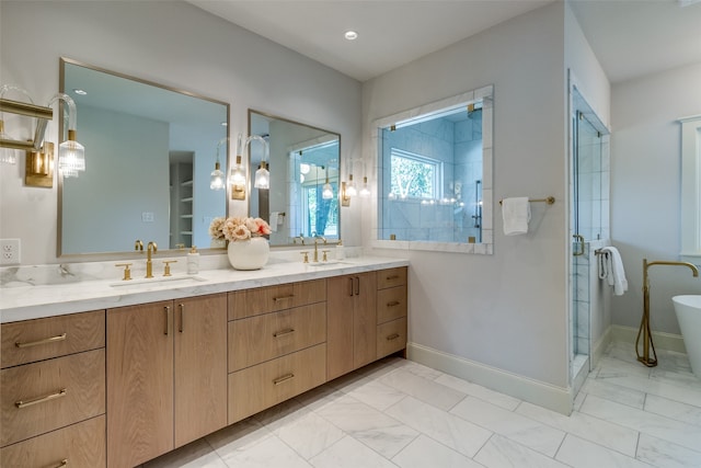 bathroom with a shower with door and vanity