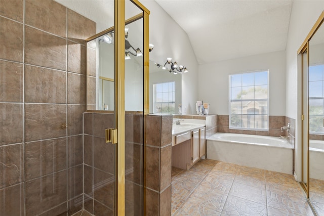 bathroom featuring independent shower and bath, vanity, vaulted ceiling, and tile patterned flooring