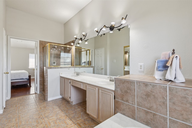 bathroom with vanity, tile patterned floors, and walk in shower